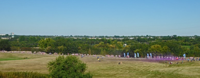 The last wave of runners coming in. Purple station before the Finish line.
