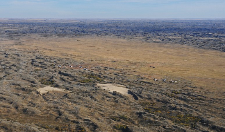 A homestead on the south edge of the dunes depicts the size of a hill.